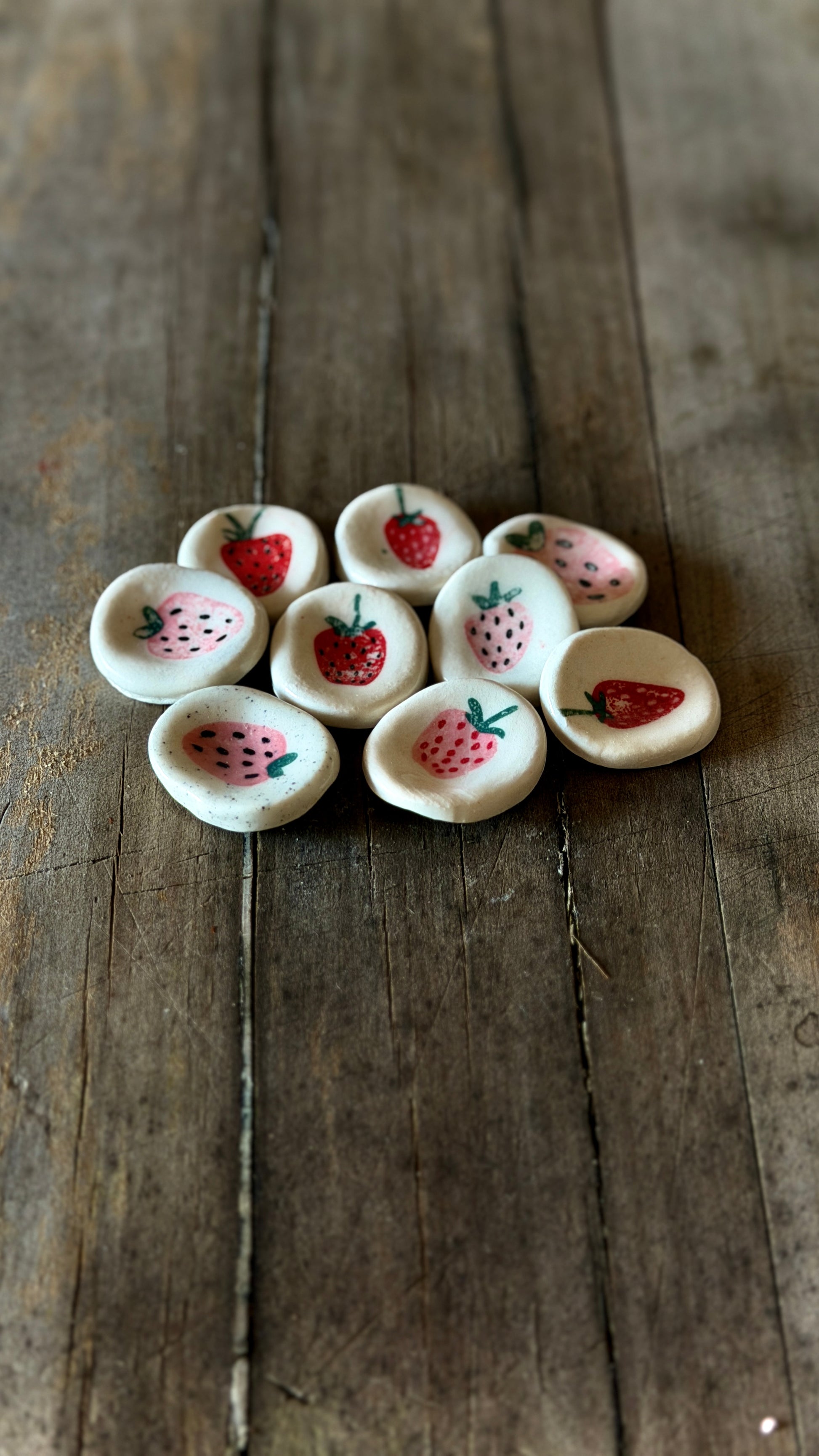Handmade ceramic strawberry worry stone for grounding and mindfulness.