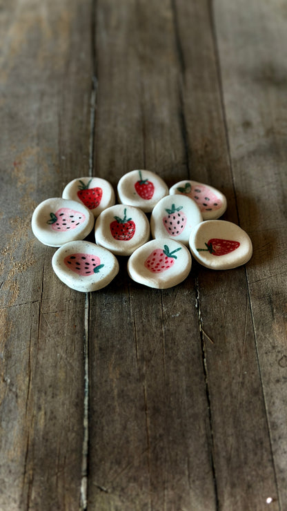 Handmade ceramic strawberry worry stone for grounding and mindfulness.